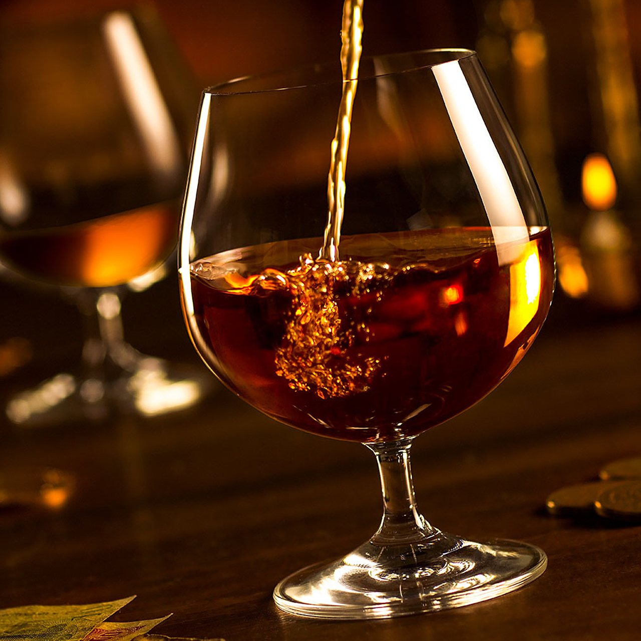 An image of whiskey pouring into a glass