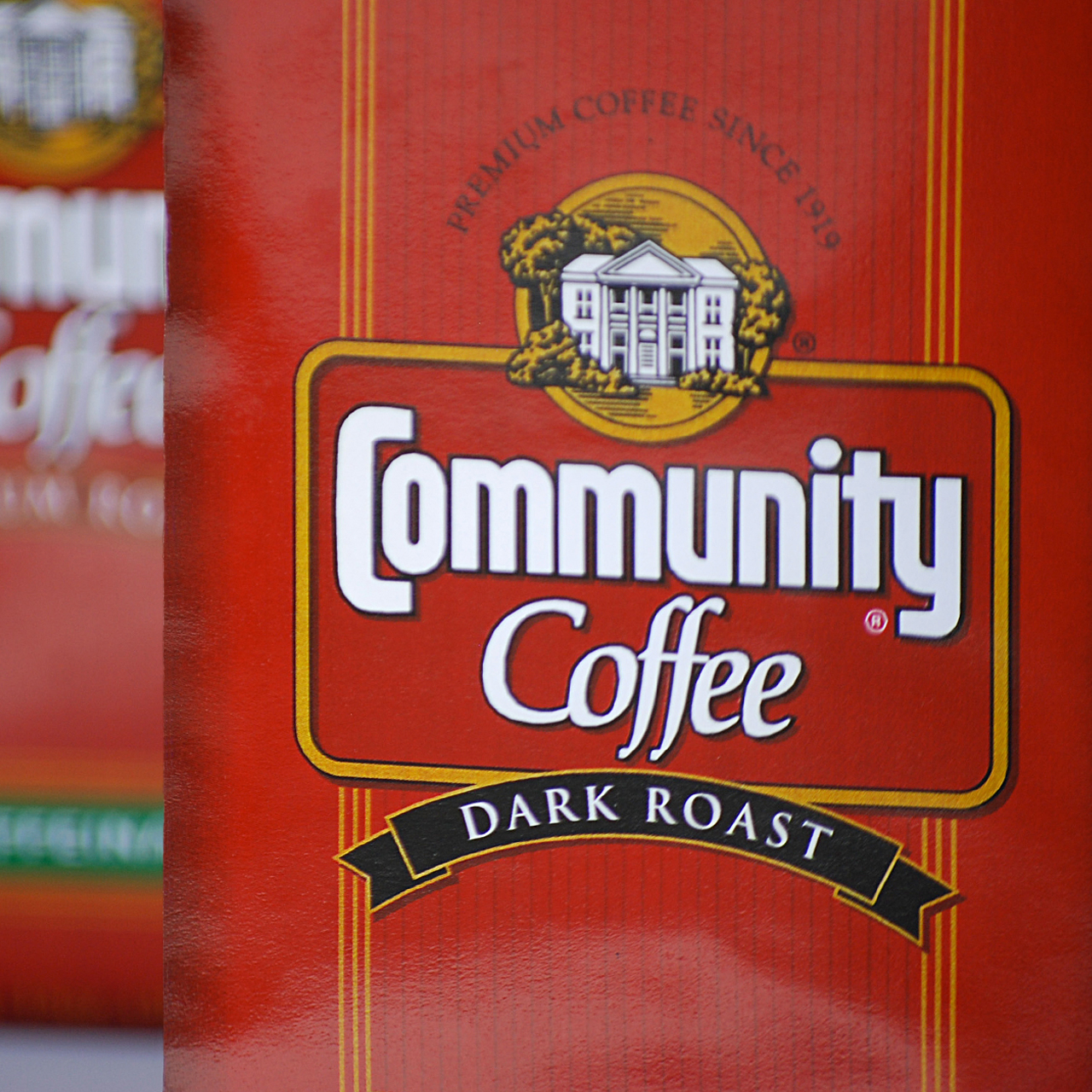 An image of the front of Community Coffee's package Design for Dark Roast Coffee