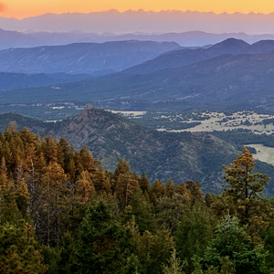 An image of mountains at sunset