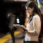 Girl holding HP laptop