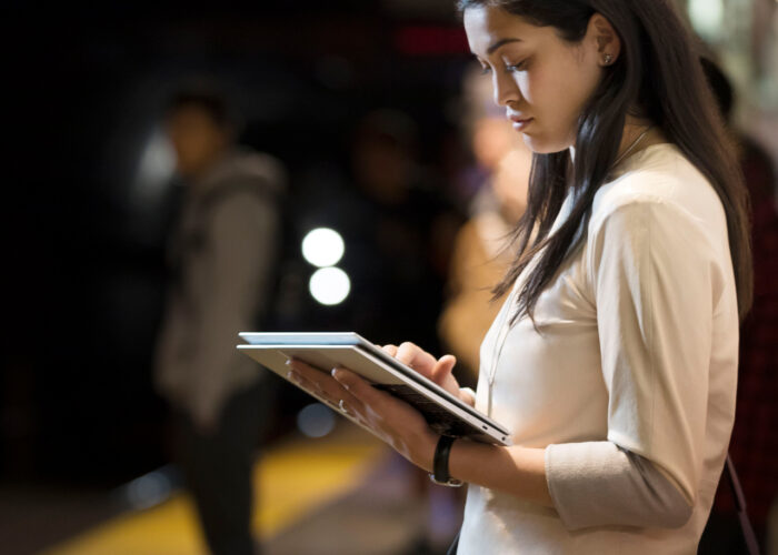 Girl holding HP laptop